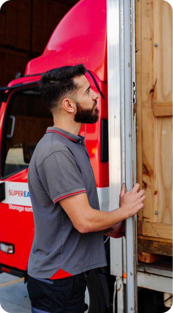 Customers beside a Super Easy Storage truck