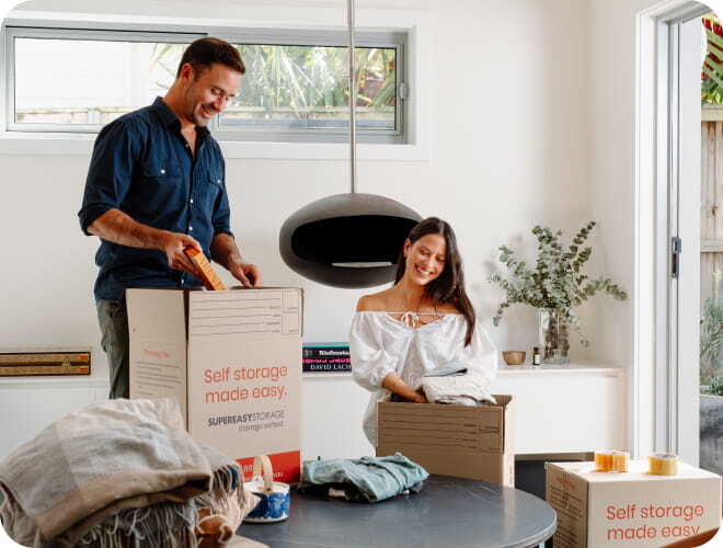 Customer packing a self-storage unit at home